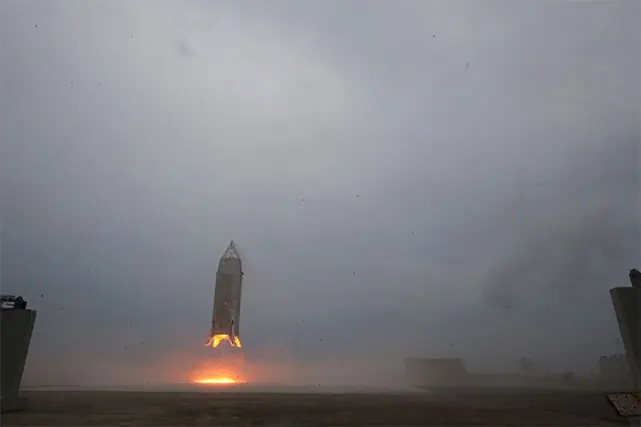 A PROTOTYPE reusable rocket descends at the Noshiro rocket testing centre.—AFP
