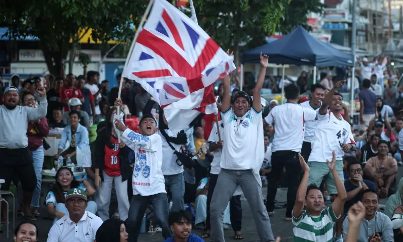 Football fans watch a live broadcast of the 2026 FIFA World Cup quarter-final match between England and Norway, during a public viewing in Ternate, North Maluku, on July 12, 2026. — AFP