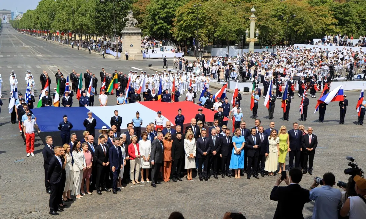 France&rsquo;s President Emmanuel Macron (C-R) poses with Heads of State and Government of the Coalition of the Willing for a family photo at the end of the annual Bastille Day military parade on the Champs-Elysees Avenue in Paris on July 14, 2026. &mdash;AFP
