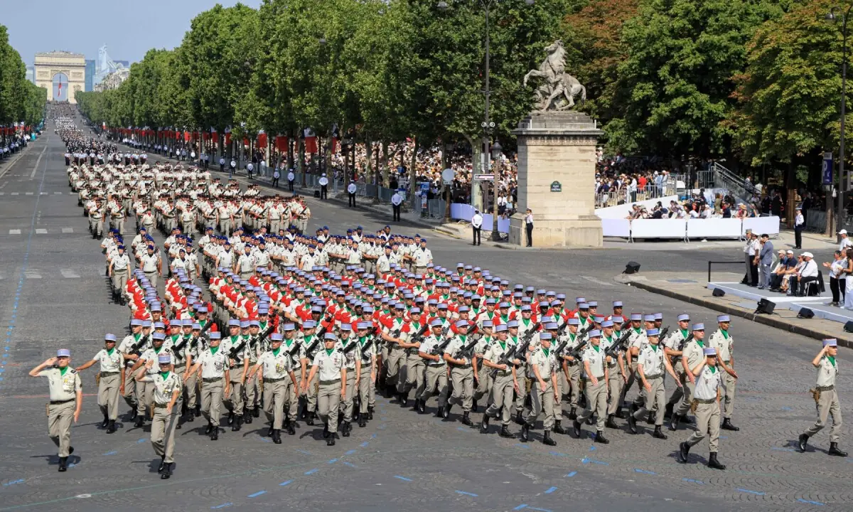 Soldiers of the 12th Cuirassier Regiment Contact Block (12e r&eacute;giment de cuirassiers &ndash; bloc m&ecirc;l&eacute;e/contact) march during the annual Bastille Day military parade on the Champs-Elysees Avenue in Paris on July 14, 2026. &mdash;AFP