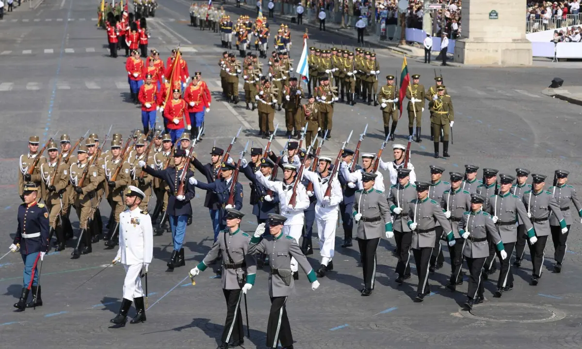 (From L) Members of the Coalition of the Willing (CoW) from Hungary, Greece and Finland march during the annual Bastille Day military parade on the Champs-Elysees Avenue in Paris on July 14, 2026. &mdash;AFP