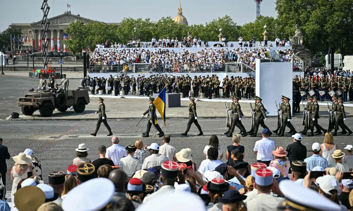 Ukrainian troops parade with the Coalition of volunteers of invited foreign nations during the annual Bastille Day military parade at the Place de la Concorde in Paris on July 14, 2026. &mdash;AFP