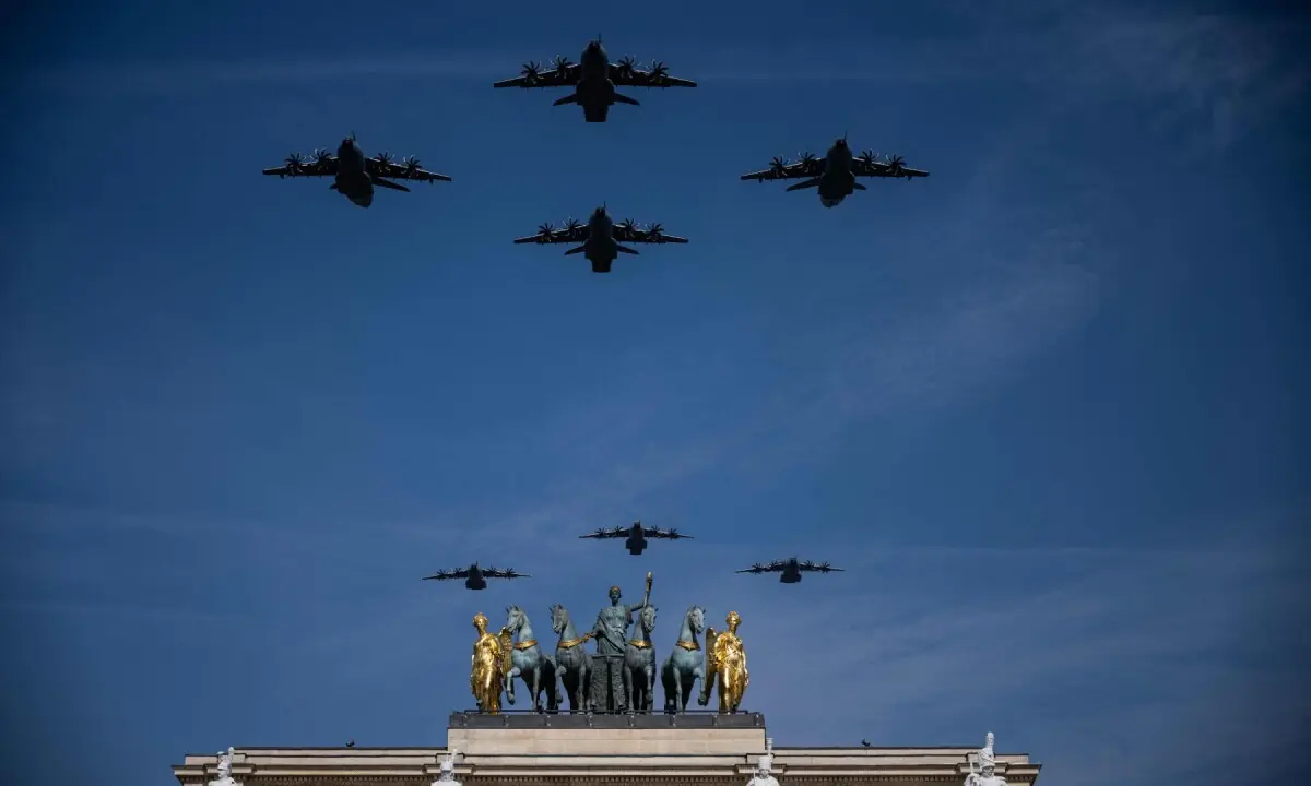 Military aircrafts perform a flyover during the annual Bastille Day military parade over the Arc de Triomphe du Carroussel and its copy of the quadriga of the horses of Saint Mark in Paris on July 14, 2026. &mdash;AFP