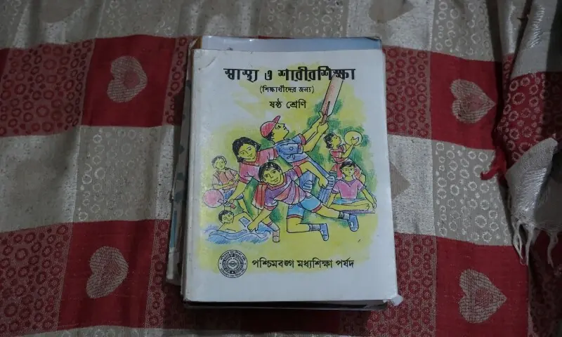 A health and physical education textbook of an 11-year-old girl who was raped and killed last week, is kept inside her parents’ house in a town near Kolkata, West Bengal, India on July 11, 2026. —Reuters/File