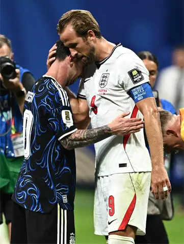 Lionel Messi hugs Harry Kane of England after their semi-final.—Reuters