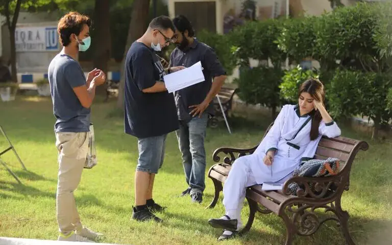 Director Haseeb Hasan (C) and Sajal Aly (R) on location during the shooting of Dhoop Ki Deewar