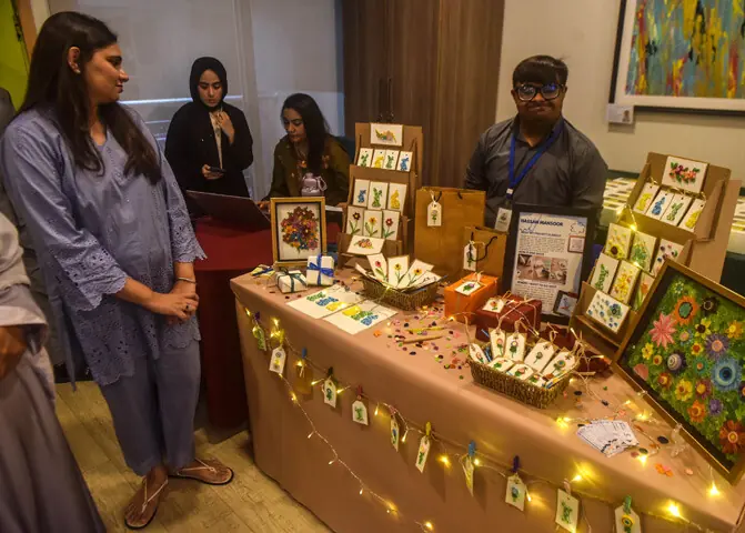 The creative genius Hassan Mansoor displays his decorative tags, cards and framed creations. —Fahim Siddiqi / White Star