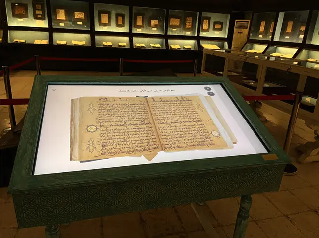 Digitised pages of the Quran written in the Kufic script in the Manuscripts Gallery at the Lahore Museum: visitors can now zoom into the pages and view minute details of the writing and manuscript production | Photo by the writers