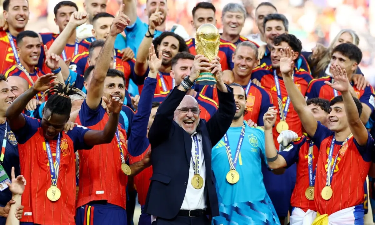 Spanish coach Luis de la Fuente lifts the FIFA World Cup trophy as the team celebrates their victory at the New York/New Jersey Stadium, East Rutherford, New Jersey, the US on July 19, 2026. &mdash; Reuters