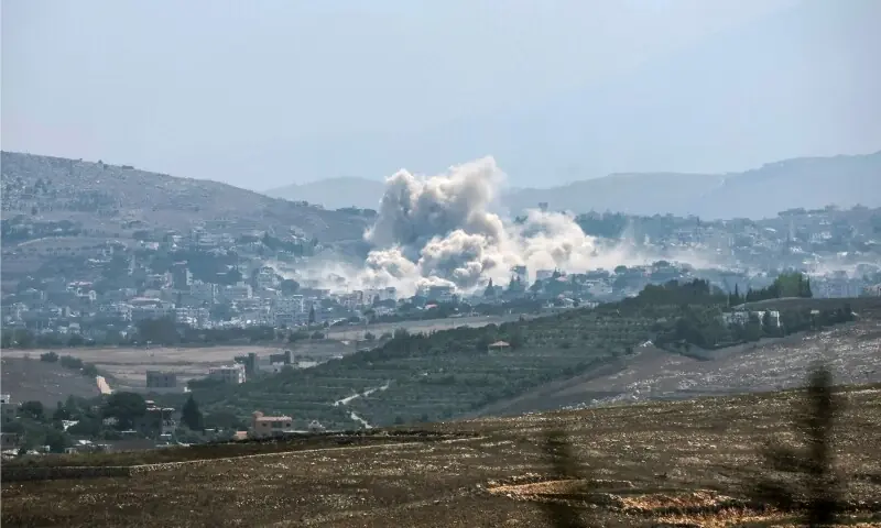 This image taken from the vicinity of the village Zawtar al-Sharqiyah in southern Lebanon, shows smoke rising from the site of an explosion carried out by the Israeli military, in the village of Kfar Tibnit on July 23, 2026. &mdash;AFP