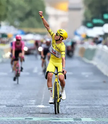 UAE Team Emirates-XRG’s Slovenian rider Tadej Pogacar celebrates his overall victory as he crosses the finish line during the 21st stage of the Tour de France on Sunday.—AFP