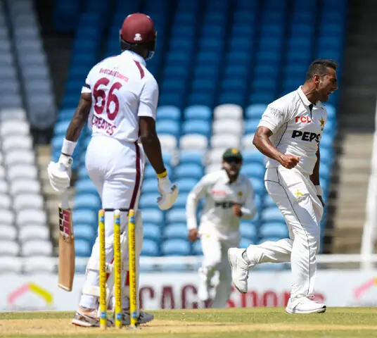 TAROUBA: Pakistan pacer Mohammad Ali (R) celebrates dismissing West Indies batter Justin Greaves during their first Test at the Brian Lara Cricket Academy on Sunday.—AFP
