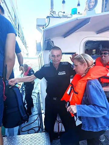  BULGARIAN police evacuate passengers from the ship after it ran aground in shallow waters on the Danube.&mdash;AFP  