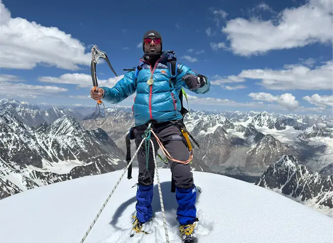  One of the mountaineers at the summit. &mdash; Dawn 