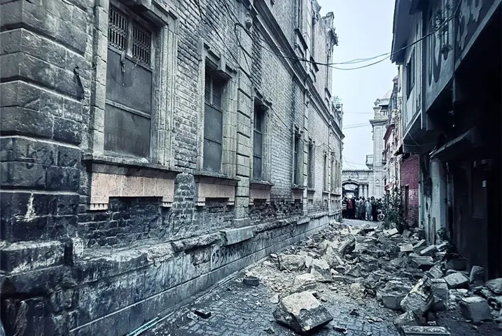 DEBRIS fallen from the upper portion of heritage site, Gangaram Nivas Building, in Hyderabad litters the adjacent street on Saturday.—Umair Ali