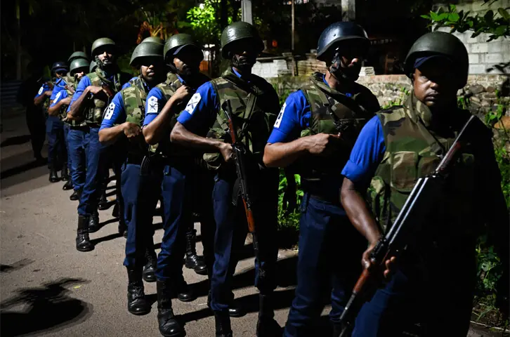 PERSONNEL of Sri Lanka’s navy take up position after the riot.—AFP