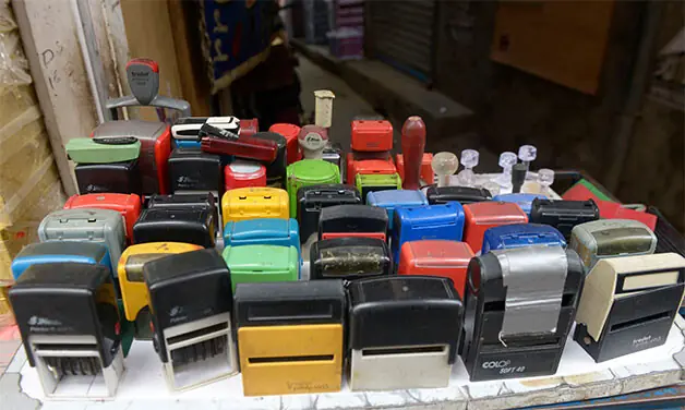 Stamps and office seals are being made at shops in Urdu Bazaar.
