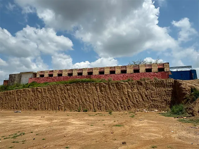 Excavation around a government school in Taxila’s Dhoke Syedo area poses serious risk to the structural integrity of the building. — Dawn