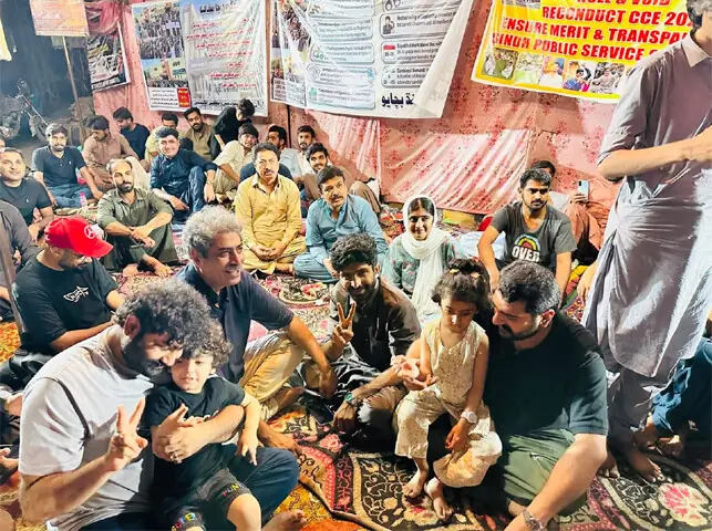 A GROUP of protesters at the camp set up outside the SPSC offices in Hyderabad.—Dawn