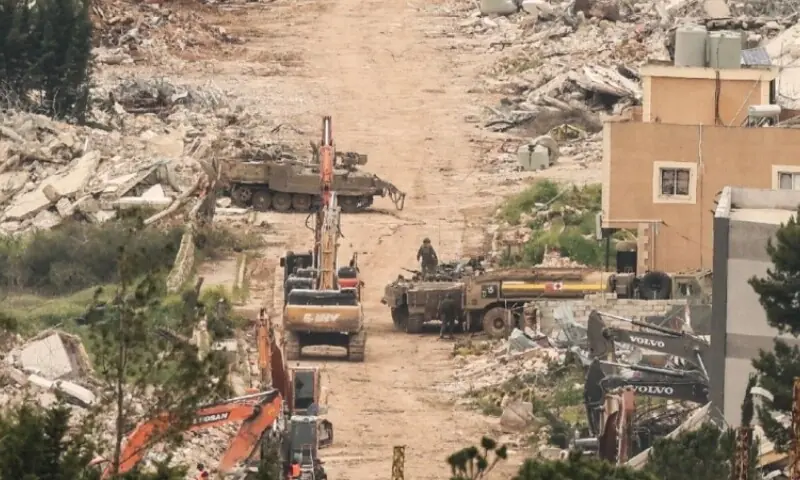 This photograph taken from the southern Lebanese village of Chaqra shows Israeli military D9 armoured bulldozers carrying out land-clearing operations in a wooded area near the entrance to the village of Houla, in the Wadi al-Slouqi area on August 4, 2026. &mdash;Reuters