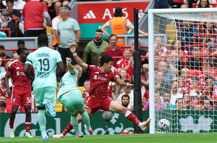 LIVERPOOL: Monaco’s Mika Biereth (second R) shoots to score during the pre-season friendly against Liverpool at Anfield on Sunday.—AFP
