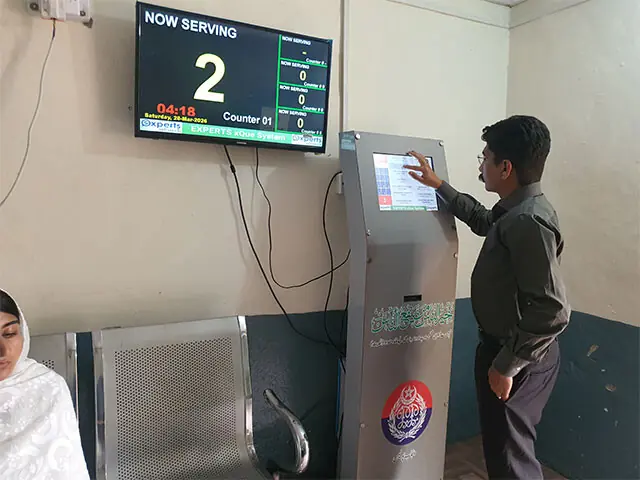  A token-dispensing machine at the front desk of the old Domeli Police Station records visitors, reflecting a more organised and modern police culture.  