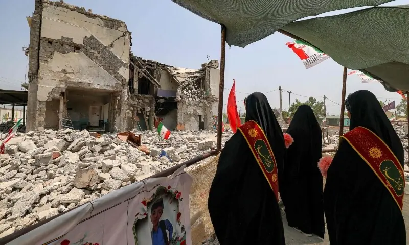 Women stand near the building of the destroyed Shajareh Tayyebeh primary school in Minab in Iran&rsquo;s Hormozgan province on August 10, 2026. &mdash;AFP