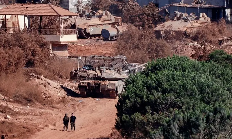 A photograph taken from the southern Lebanese viallage of of Zawtar al-Gharbiyah shows Israeli troops stationed in the nearby village of Zawtar al-Charkiyah on August 11, 2026. &mdash;AFP
