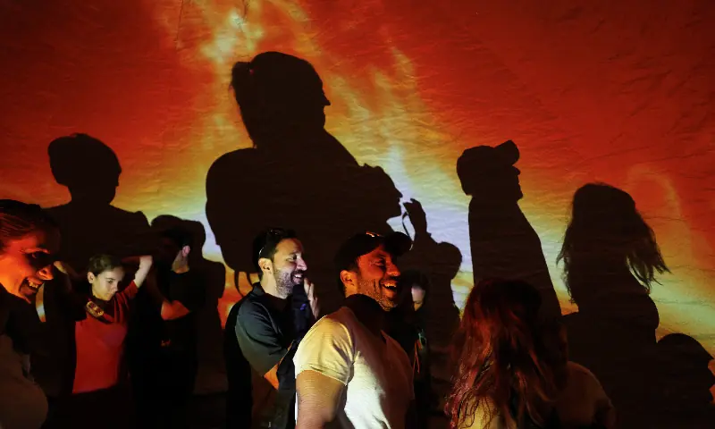 People walk out of a portable planetarium during an eclipse watch party on the day of a total solar eclipse in Buitrago del Lozoya, Spain, August 12, 2026. — Reuters