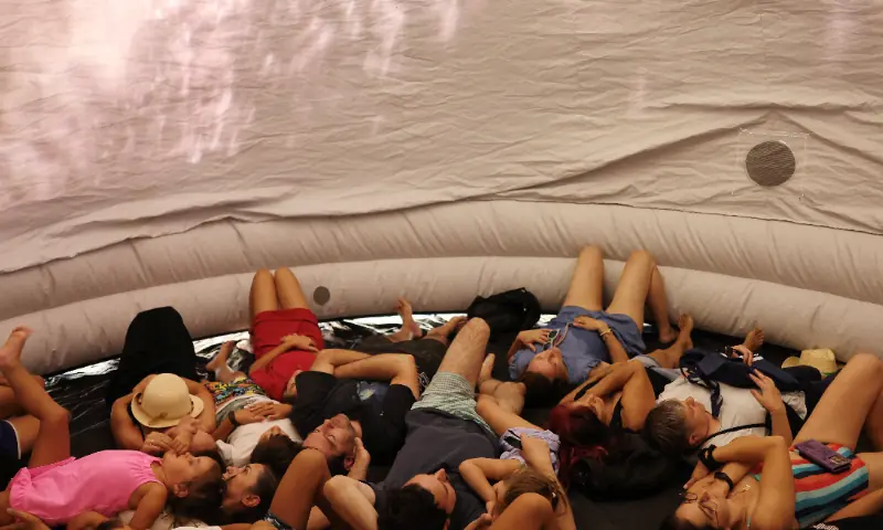 People lie down inside a portable planetarium during an eclipse watch party on the day of a total solar eclipse in Buitrago del Lozoya, Spain, August 12, 2026. — Reuters