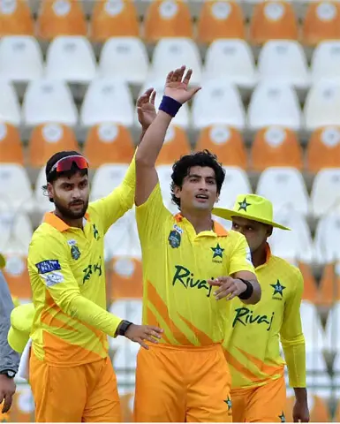 Pakistan Greens’ pacer Naseem Shah (C) celebrates after taking a wicket during the National Champions Cup match against Pakistan Whites at the Multan Cricket Stadium.—APP