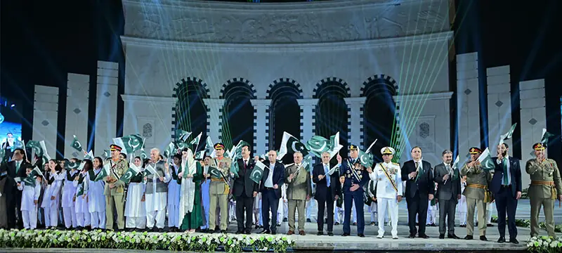  ISLAMABAD: Flanked by the country&rsquo;s top civilian and military leadership, President Asif Ali Zardari, Prime Minister Shehbaz Sharif and Chief of Defence Forces Field Marshal Asim Munir wave the national flag during the inauguration of the Yadgar-i-Fatah monument, on the eve of Independence Day.&mdash;Courtesy PID 