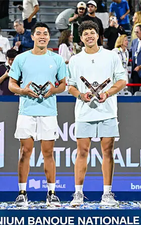 MONTREAL: Ben Shelton (R) of the US and compatriot Brandon Nakashima hold up their trophies after their Montreal Masters final at Stade IGA.—AFP
