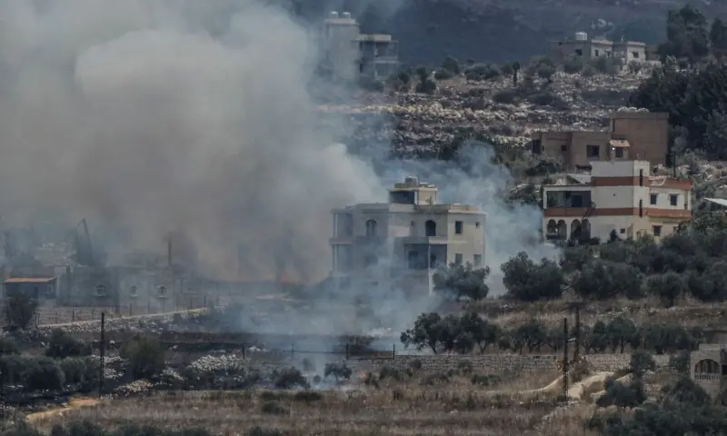 A photograph taken from the southern Lebanese village of Qabrikha shows smoke rising from burning fields in the village of Bani Hayyan, under the control of the Israeli military, about 10 kilometers from the Lebanon-Israel border on August 14, 2026. &mdash;AFP