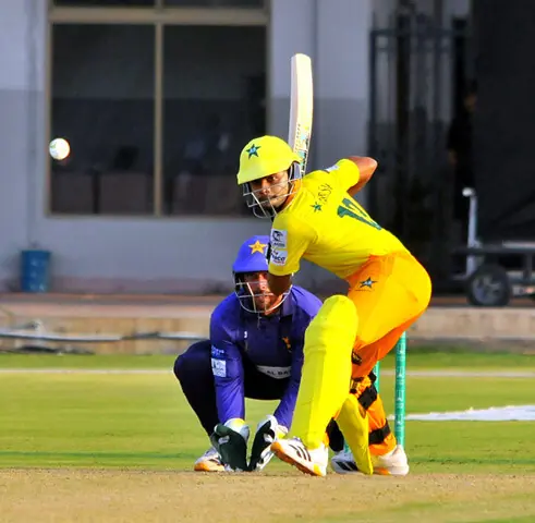   PLAYERS of Pakistan Greens and Pakistan Blues in action during the National Champions Cup match at the Multan Cricket Stadium.&mdash;APP 