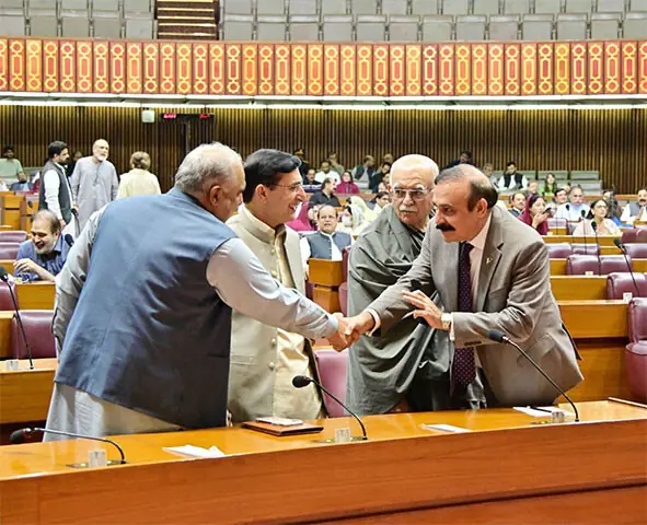 Tariq Fazal Chaudhry greets PTI’s Asad Qaisar and Gohar Ali Khan, as Mehmood Khan Achakzai looks on.—FB/NAOfPakistan