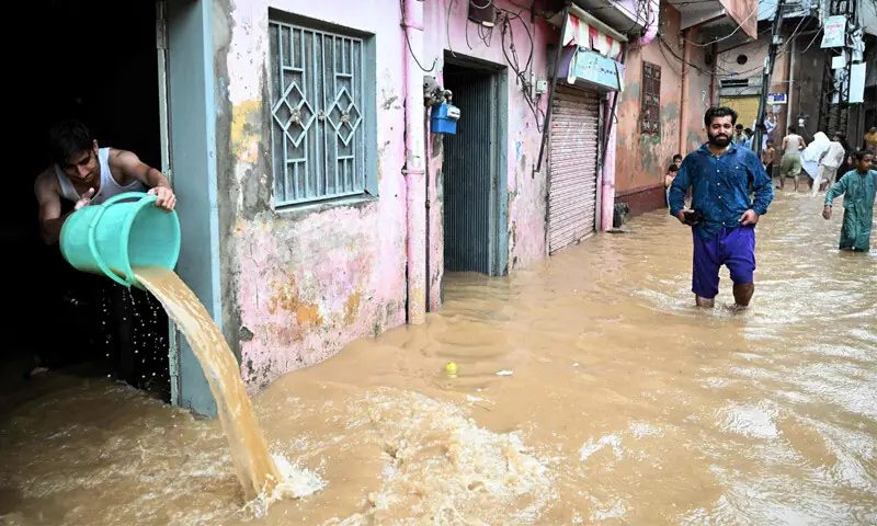  A Man removes floodwater from his home in Rawalpindi on Wednesday, as residents of the twin cities witnessed this season&rsquo;s highest monsoon rainfall.&mdash;AFP 