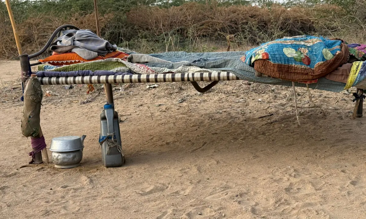  A charpai, faded rilli and a repurposed oil tin for drinking water inside an otaak in the settlement. 