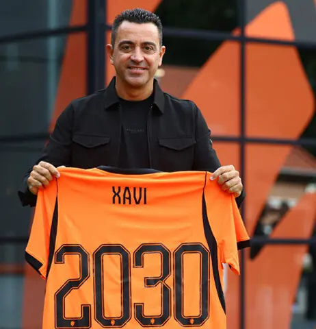   ZEIST: Netherlands coach Xavi Hernandez poses with the kit to announce his new contract at the KNVB Campus on Tuesday.&mdash;Reuters 