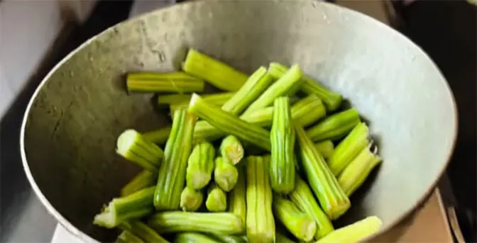 Cooking the moringa drumsticks