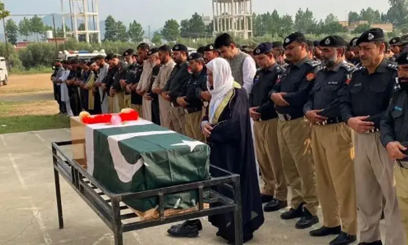 Funeral prayers of a martyred cop in Bajaur, Khyber Pakhtunkhwa on August 14, 2026: a security official killed while serving is mourned as a representative of the state | Anwarullah KHan