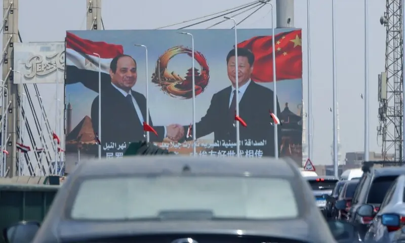 Cars drive in traffic beneath a large screen displaying portraits of Egypt’s President Abdel Fattah al-Sisi and China’s President Xi Jinping, along with a message reading in Arabic, “The Egyptian-Chinese friendship welcomes Egypt’s guest, His Excellency President Xi Jinping, President of the People’s Republic of China,” in Cairo, Egypt, on September 1, 2026. —Reuters/File