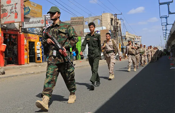 Gunmen loyal to the rebels march during a recruitment drive in Sanaa.—AFP