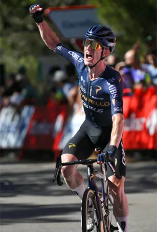 TEAM Q36.5’s Irish rider Eddie Dunbar celebrates as he wins the 19th stage of the Vuelta a Espana, a 210.8km distance from Velez-Malaga to Alto de Penwas Blancas, on Friday.—AFP