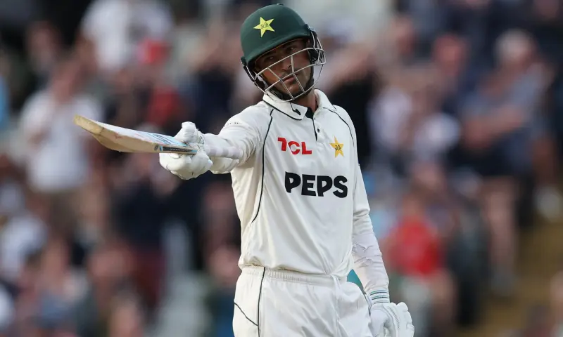 Razaullah celebrates scoring his half century.–Reuters
