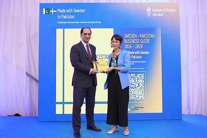 Ambassador of Sweden Alex Berg von Linde presents federal secretary Ministry of Commerce Jawad Paul a copy of Sweden-Pakistan Business Guide 2026-28. — Dawn