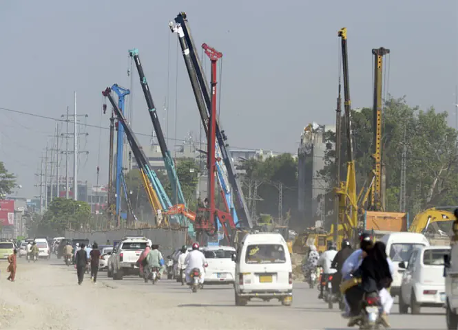   Work on underpasses on Peshawar Road has not only suspended public transport but also led to the closure of educational institutions in the area. &mdash; File photo  