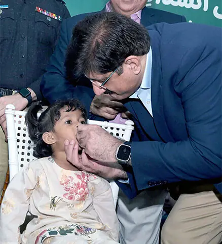 Chief Minister Murad Ali Shah administers polio drops to a child.—PPI