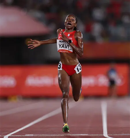 BAHRAIN’S Winfred Yavi rejoices as she crosses the finish line to win the 10,000m final at the Paloma Mizuho Sports Park on Thursday.—Reuters