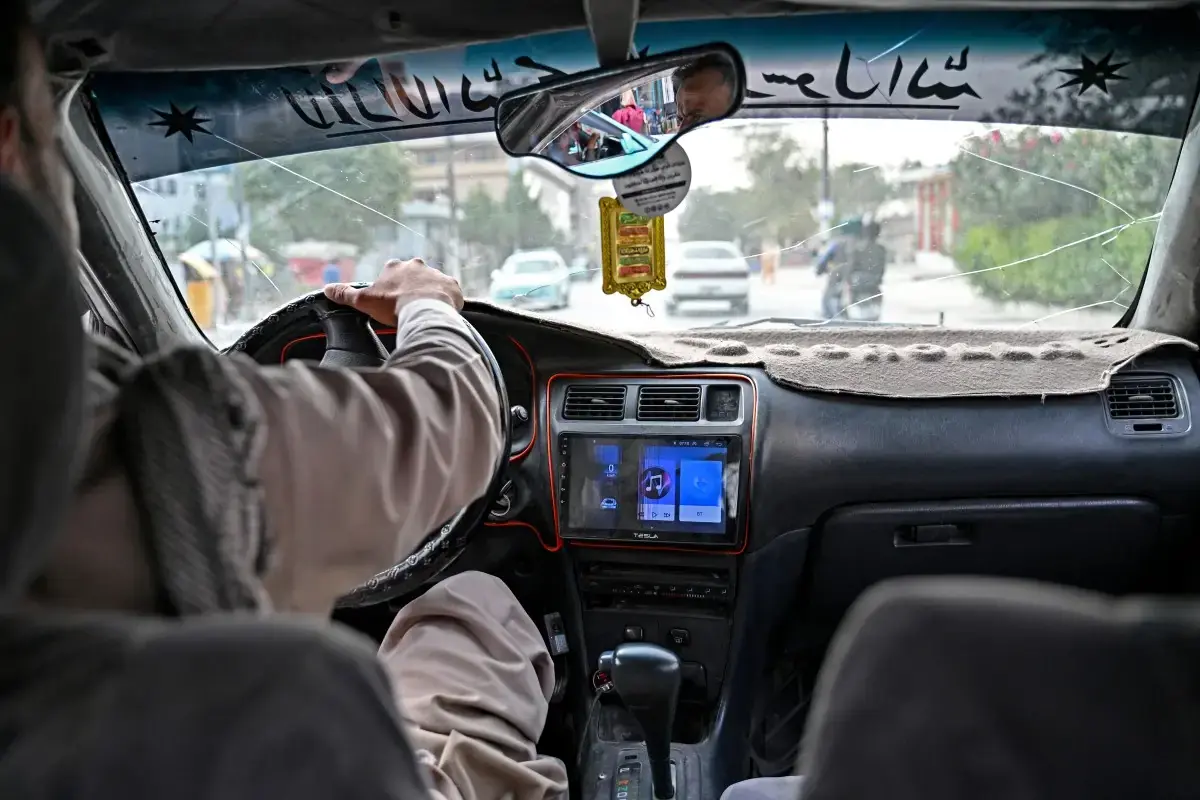 Afghan taxi drivers turn up the music, defying Taliban ban